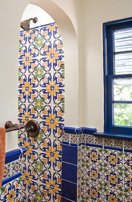 Hand-painted Spanish wall tile are used for the show and bathroom wall