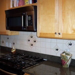 Olive Tile Design Lends Rustic, Tuscan Charm to Backsplash