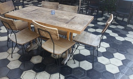 The patio at Zinqué  Cafe in Los Angeles California uses Hexagon Cement Tiles to create a hip vibe