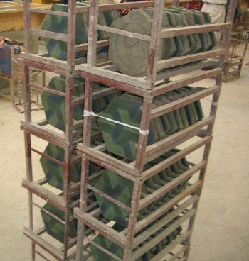 Racked Cement Tiles Await a Water Bath to Cure the Cement